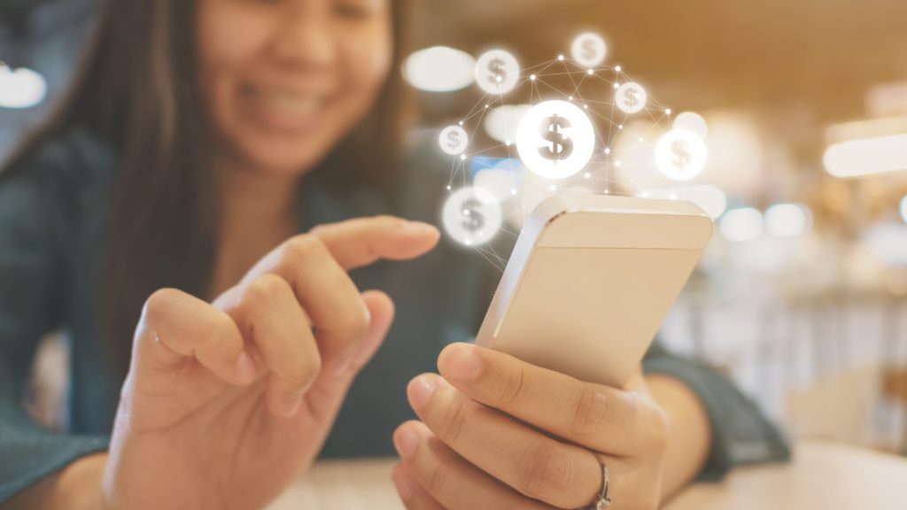 a person types on a mobile phone to check out the 99 Best Money Making Apps